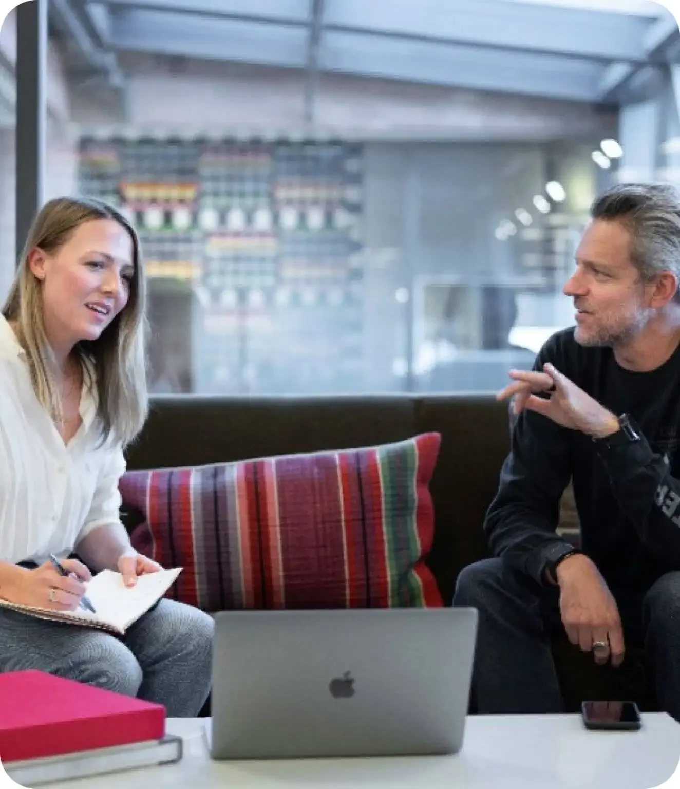 Hotel marketing team planning campaigns on a laptop